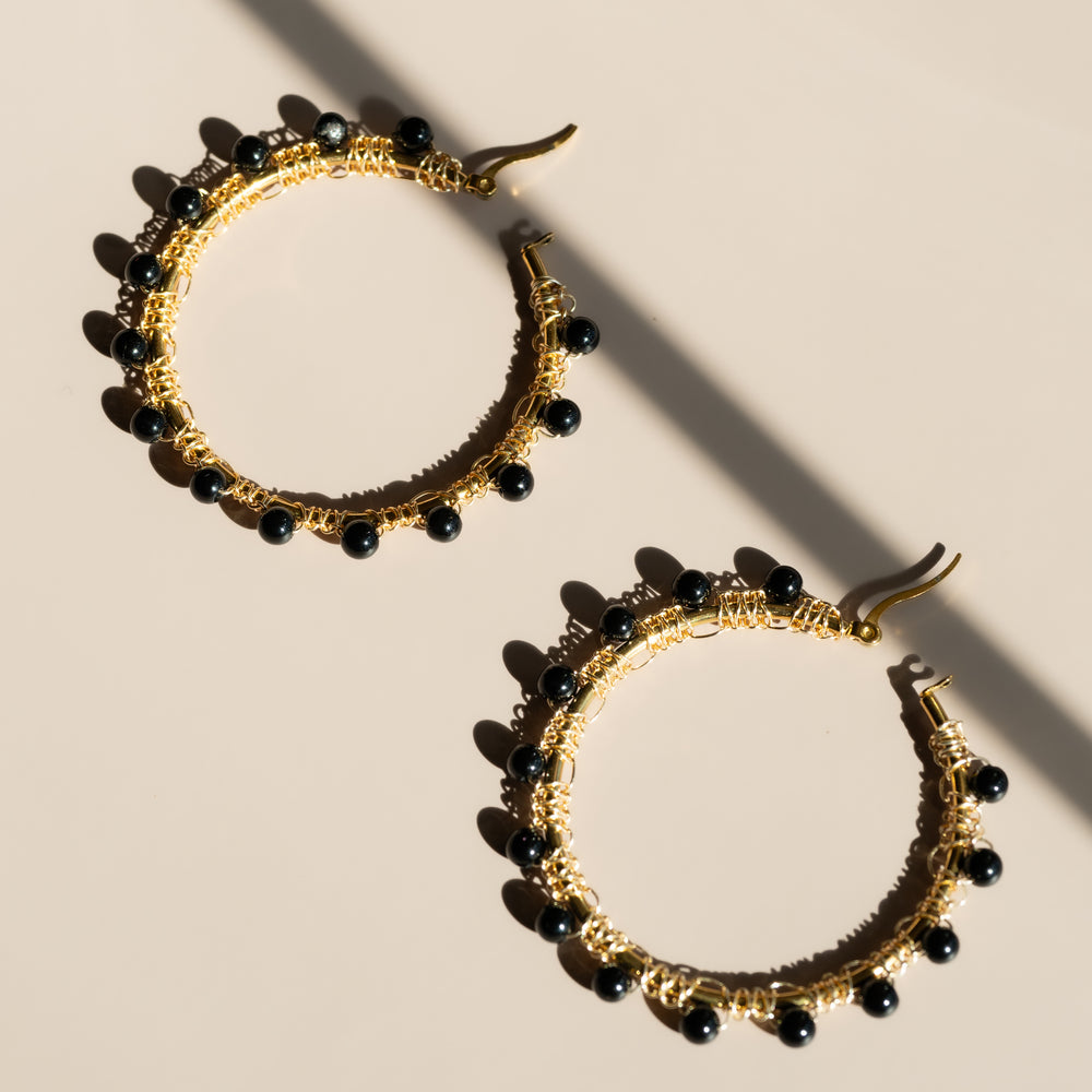 
                      
                        Raven Hoop Earrings
                      
                    