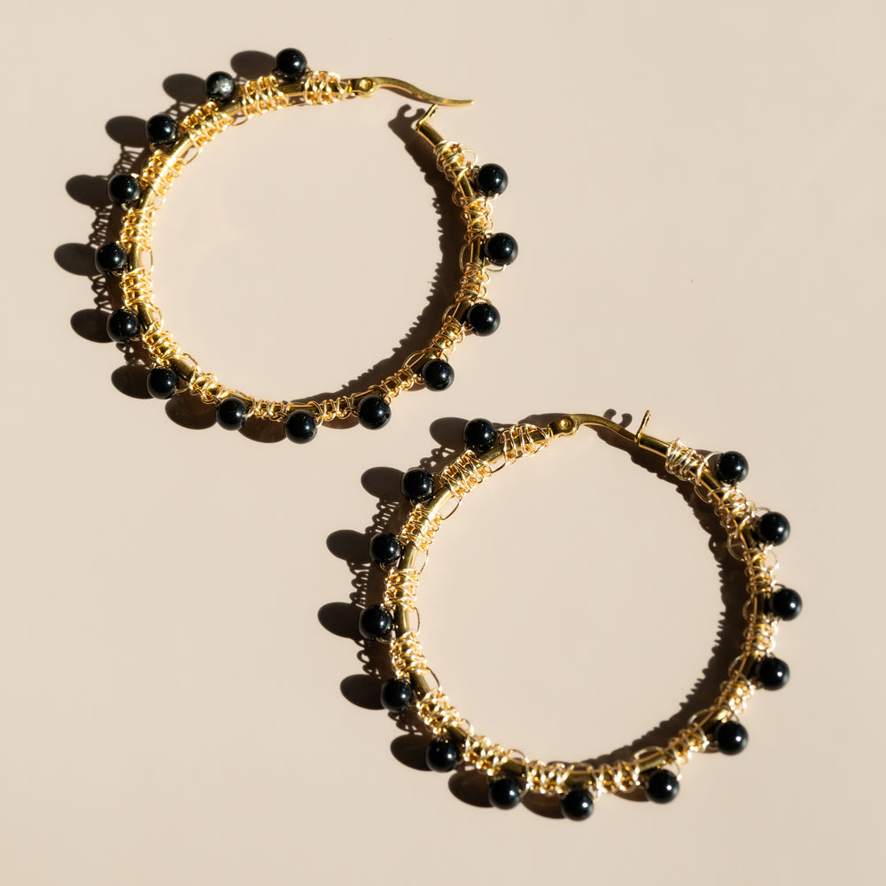 
                      
                        Raven Hoop Earrings
                      
                    